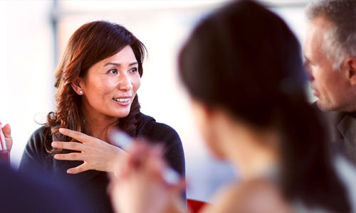 woman talking during business meeting