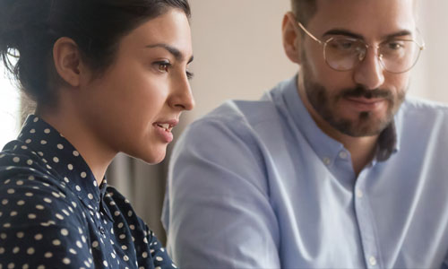 Woman working with man in a financial service environment